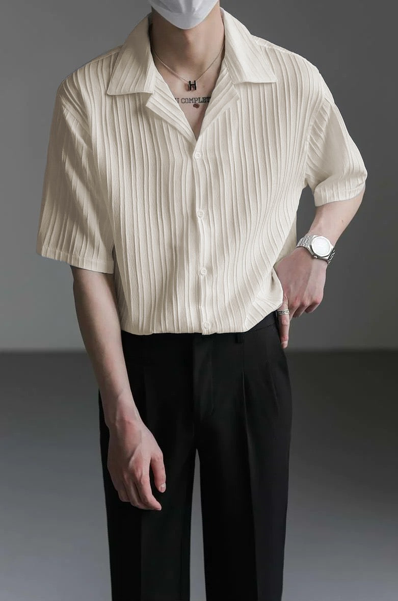 Close-up of Cuban collar and texture in ivory shirt