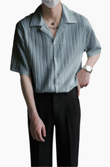 Model wearing blue stripe lapel collar oversized shirt